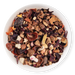 Assorted dried fruit and tea leaves in a white bowl on a white background
