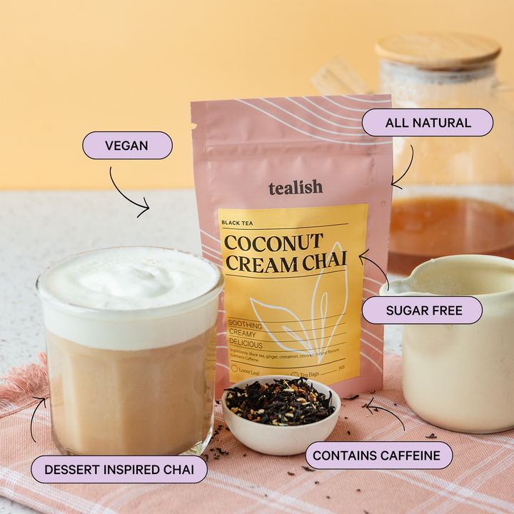 Tealish Coconut Cream Chai package with a cup of tea and ingredients on a pink checkered tablecloth.