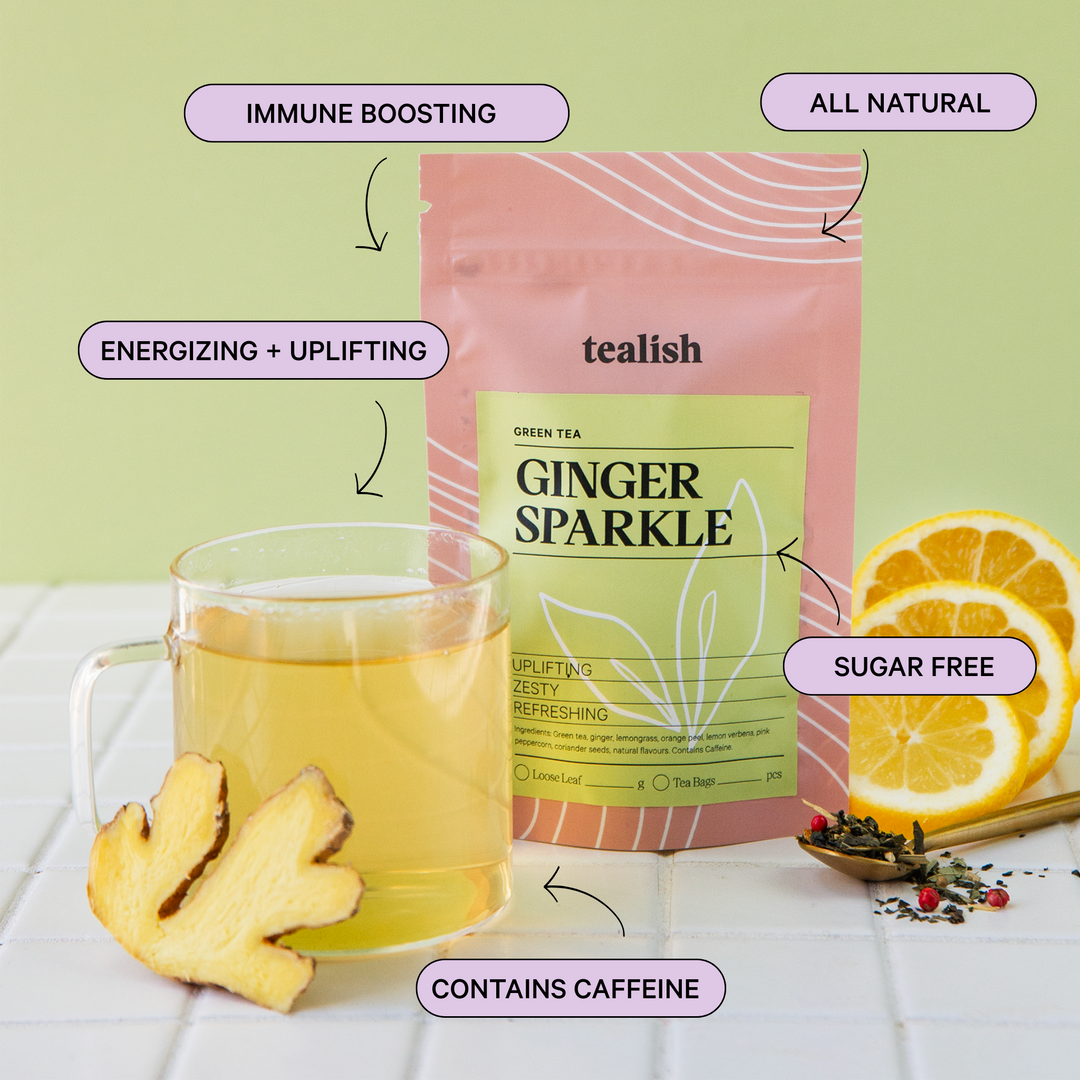 Tealish Ginger Sparkle green tea package with a cup of tea, ginger root, and lemons on a light green background.