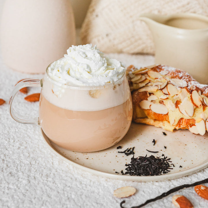 Creamy Almond Biscotti black tea latte served with almond biscotti
