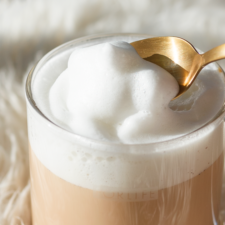 Creamy Almond Biscotti tea latte topped with frothed milk