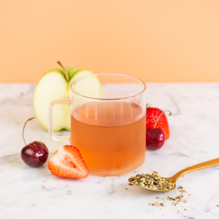 Appleberry Ashwagandha herbal tea served with fruit and loose leaf tea