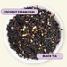 A top-down view of loose-leaf black tea in a white bowl, labeled 'COCONUT CREAM CHAI' and 'BLACK TEA' on light purple text badges. The tea blend is predominantly very dark brown to black with visible coconut flakes and small dried fruit pieces.