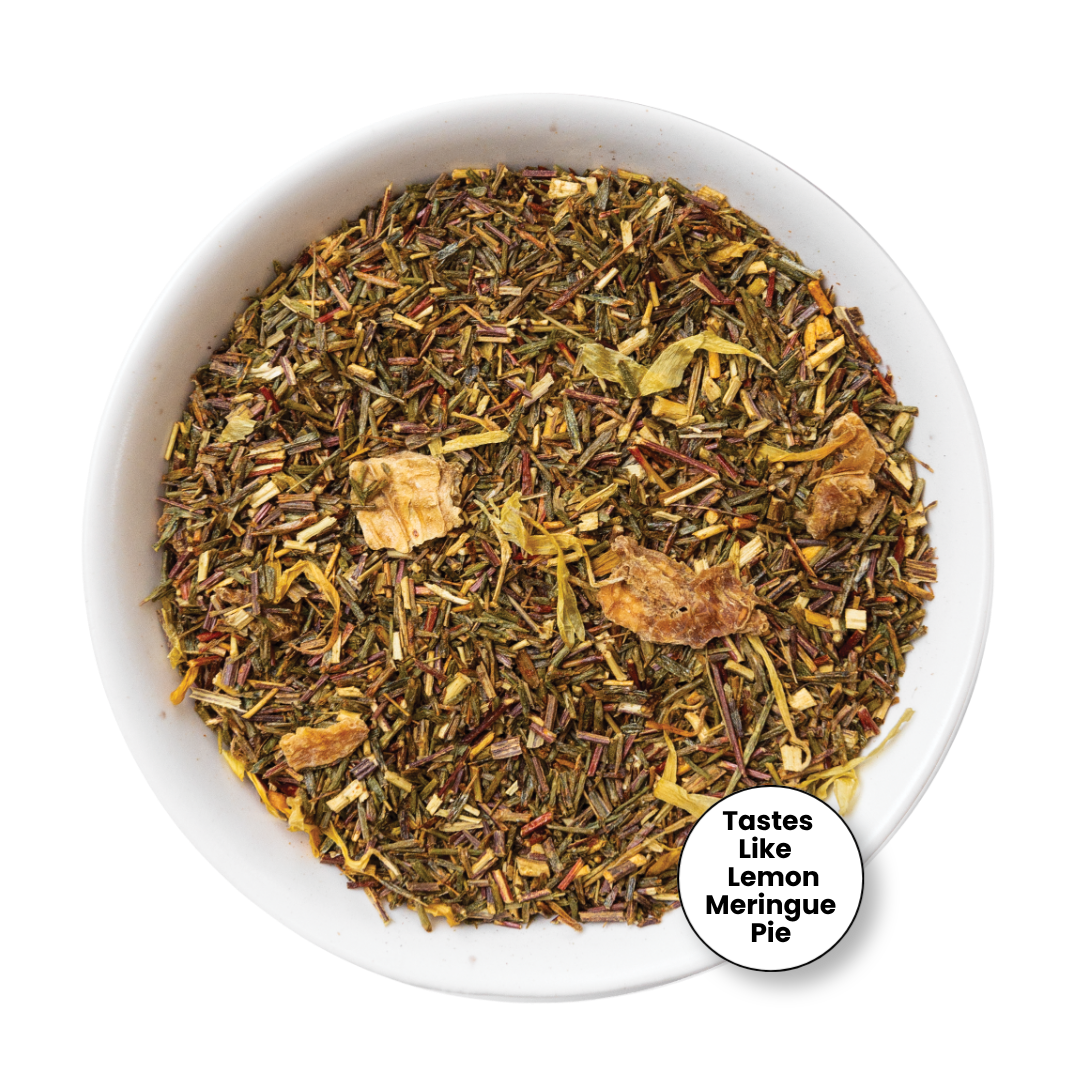 A top-down view of a loose leaf herbal tea blend in a white bowl, with a small circular badge in the lower right that reads &