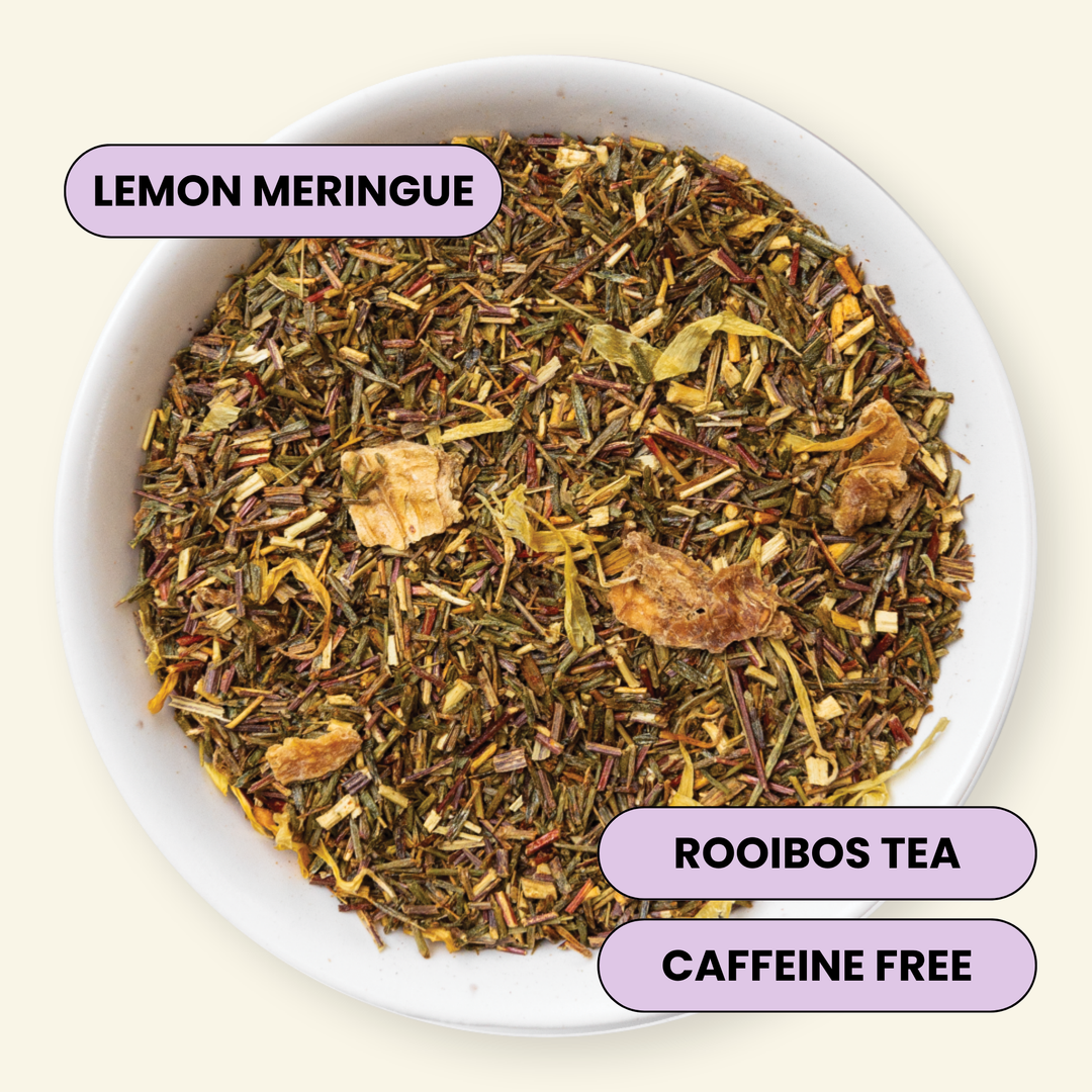 A top-down view of a white bowl filled with loose-leaf Rooibos tea labeled &