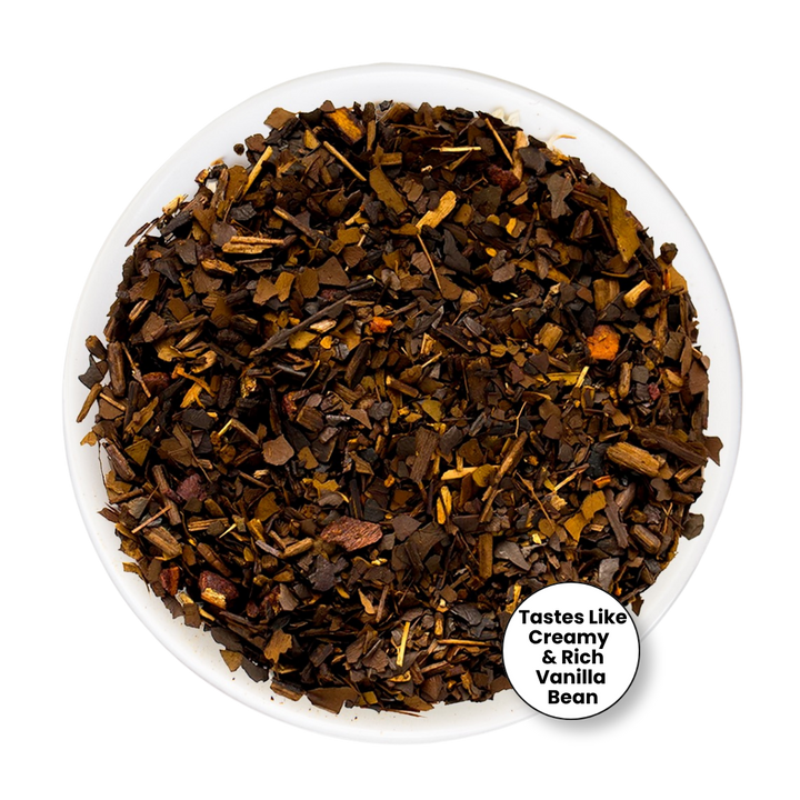 A top-down view of a white bowl filled with loose-leaf vanilla bean tea. The tea consists of dark brown and black dried vanilla bean pieces with lighter brown and tan fragments.