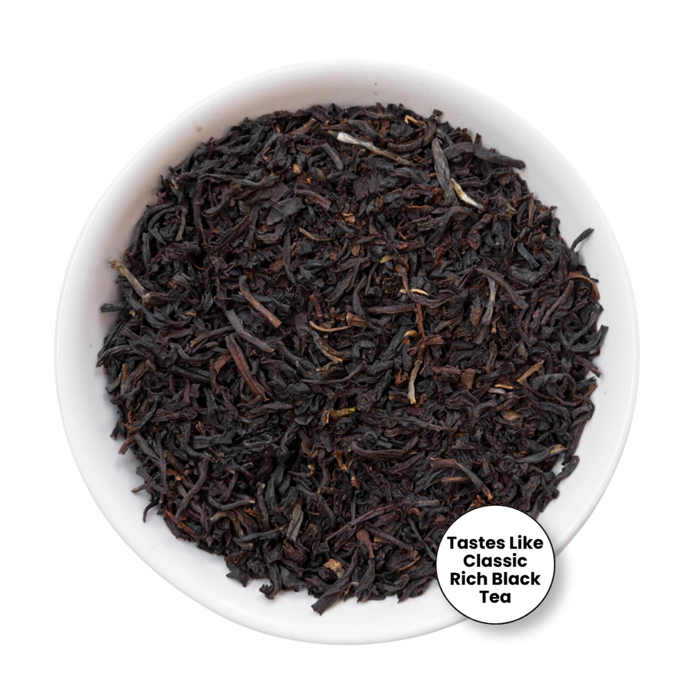 A top-down view of loose-leaf tea in a small white bowl, with a circular badge in the lower right that reads 'Tastes Like Classic Rich Black Tea.'.