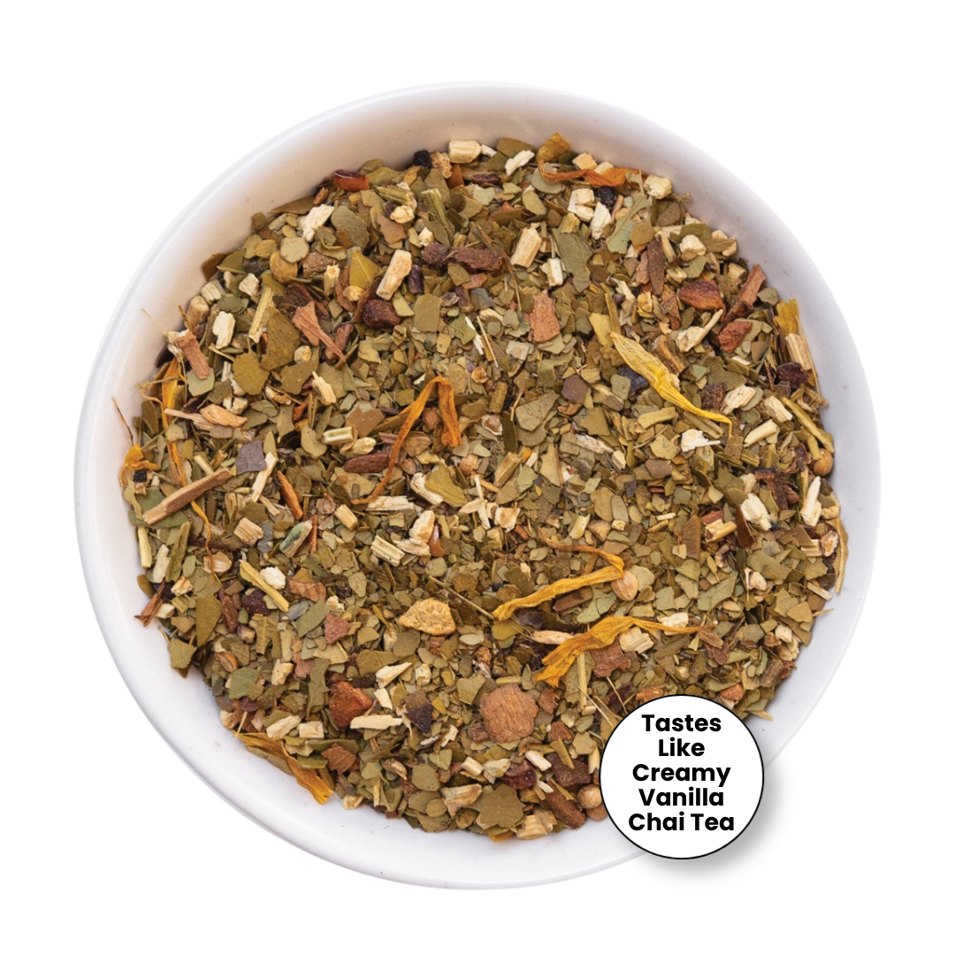 A top-down view of a white bowl filled with loose-leaf herbal tea blend, with a small white circular label in the lower right that reads &