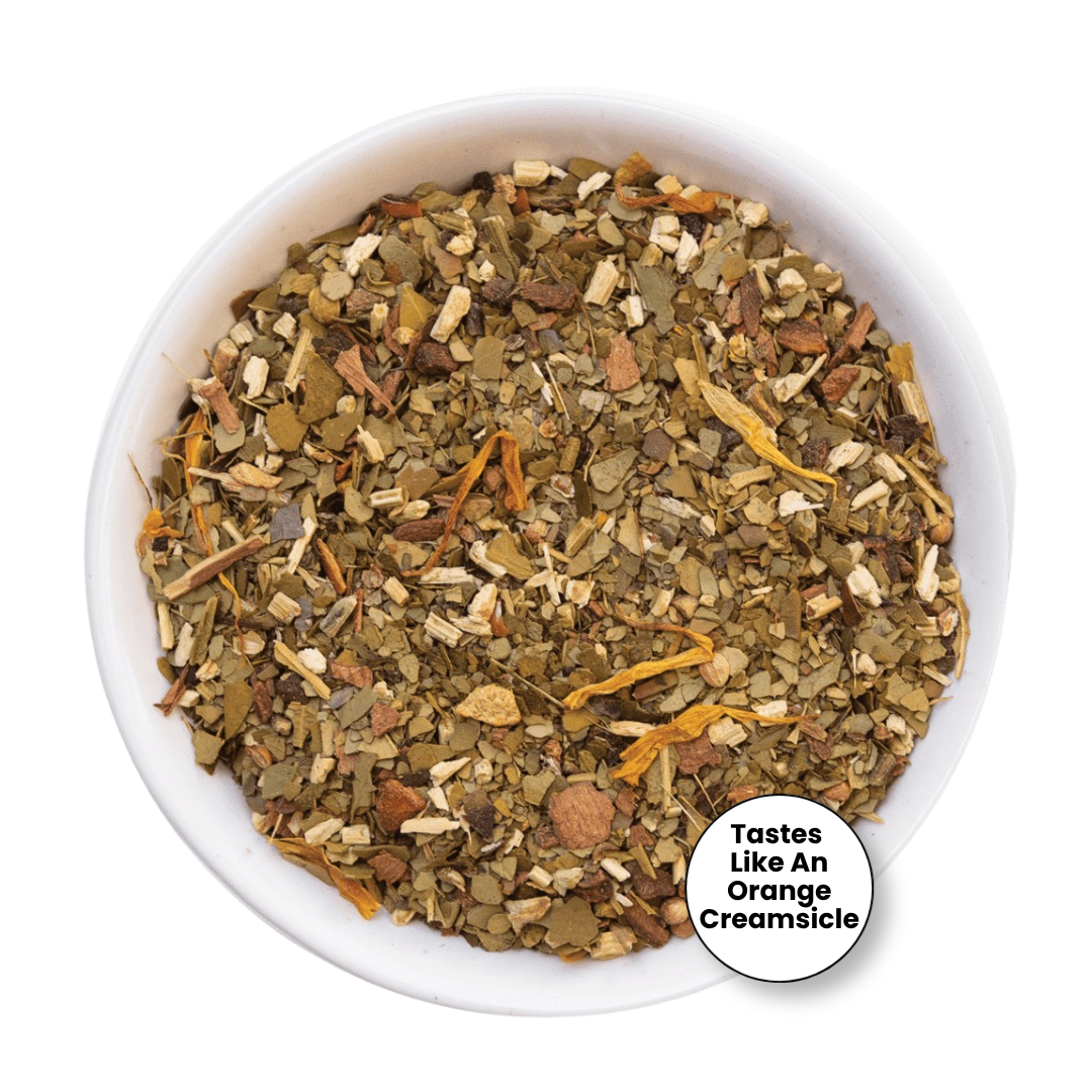 A top-down view of a loose-leaf herbal tea blend in a white bowl, with a small circular badge in the lower right that reads &