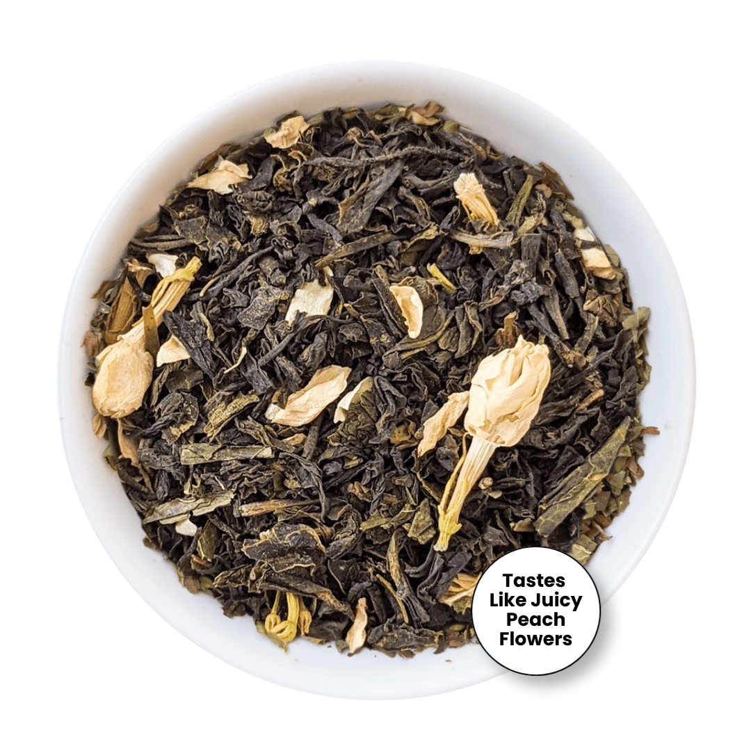 A top-down view of loose-leaf tea in a white bowl, featuring dark dried leaves mixed with pale peach flower petals. A circular badge in the lower right reads &