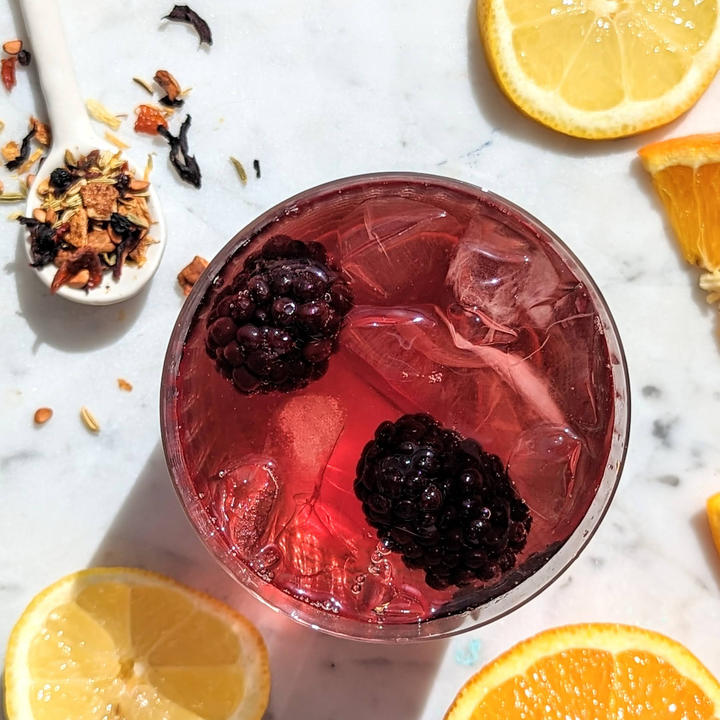 sweet pear punch fruit iced tea with citrus fruits around it