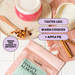 A styled flat-lay featuring a pouch of tealish Toasty Almond Herbal Tea in the background, with a pink drink on a saucer, a small bowl, cinnamon sticks, and text callouts describing flavor notes.